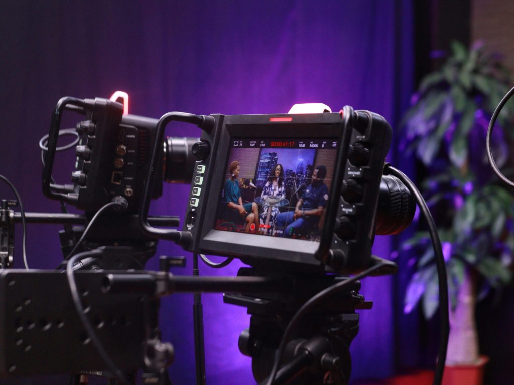 pexels-photo-18357250-18357250 Capture of a video interview scene with professional camera equipment.